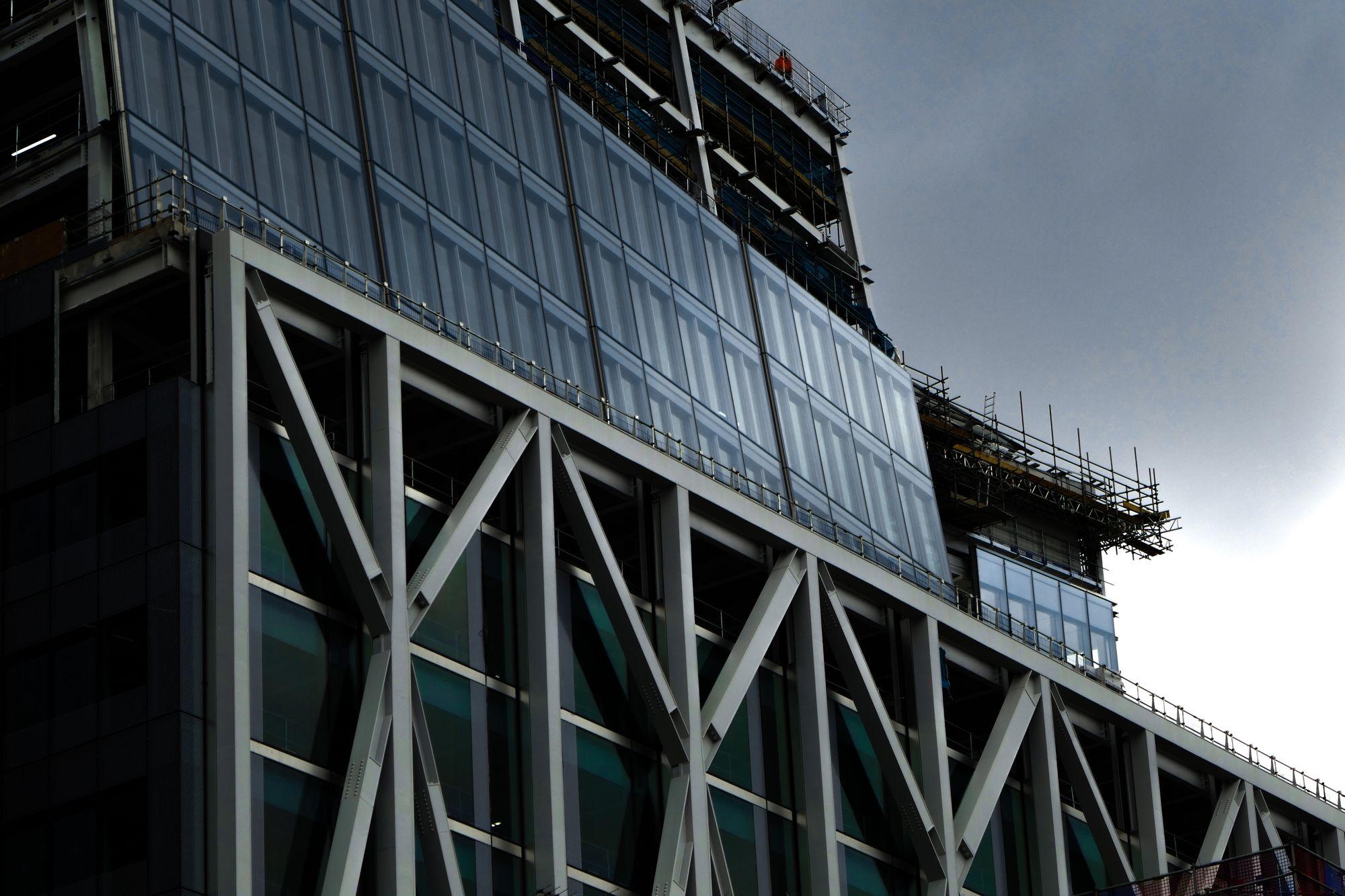 Steel bracing and glazed facade of a building under construction